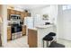 Well-equipped kitchen with stainless steel appliances and wood cabinets at 4012 Santa Maria # 101, Kissimmee, FL 34741