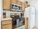 Modern kitchen boasting stainless steel microwave and stovetop at 4012 Santa Maria # 101, Kissimmee, FL 34741
