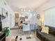 Comfortable living room with open floor plan to kitchen and dining areas at 4012 Santa Maria # 101, Kissimmee, FL 34741