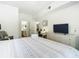Main bedroom with a king bed, dresser and access to the bathroom at 4012 Santa Maria # 101, Kissimmee, FL 34741