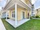 Covered patio with white columns and sliding glass door at 4012 Santa Maria # 101, Kissimmee, FL 34741