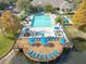 Pool area with a large deck, hot tub, and plenty of lounge chairs at 4012 Santa Maria # 101, Kissimmee, FL 34741