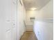 Upstairs hallway with carpet, two closets, and a stairway at 4012 Santa Maria # 101, Kissimmee, FL 34741