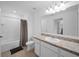 Clean bathroom with a tub shower combo and a vanity with granite countertop at 445 Madison Dr, Davenport, FL 33837