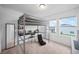 Bedroom with a built-in loft bed, desk, and chair at 445 Madison Dr, Davenport, FL 33837