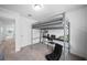 Bedroom with a built-in loft bed, desk, and chair at 445 Madison Dr, Davenport, FL 33837