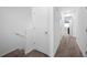 Upstairs hallway with carpeted floors and neutral walls at 445 Madison Dr, Davenport, FL 33837