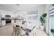 Modern kitchen with stainless steel appliances and an eat-in island at 445 Madison Dr, Davenport, FL 33837