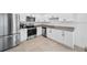 Modern kitchen with stainless steel appliances and ample cabinet space at 445 Madison Dr, Davenport, FL 33837