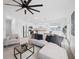 Open concept living room with a comfortable sectional sofa and kitchen views at 445 Madison Dr, Davenport, FL 33837