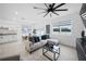 Open living space with sectional sofa and adjacent kitchen at 445 Madison Dr, Davenport, FL 33837