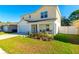 Two-story house with a covered porch and landscaped front yard at 680 Hillview Loop, Haines City, FL 33844