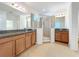 Large bathroom with granite countertops, double sinks and shower at 6818 Trellis Vine Loop, Windermere, FL 34786