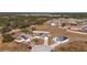 Aerial view of two houses with solar panels and fenced yards at 825 Desmoines Pl, Kissimmee, FL 34759
