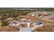 Aerial view of two houses with solar panels and fenced yards at 825 Desmoines Pl, Kissimmee, FL 34759
