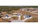 Aerial view of two houses with solar panels and fenced yards at 825 Desmoines Pl, Kissimmee, FL 34759