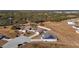 Aerial view of two houses with solar panels and fenced yards at 825 Desmoines Pl, Kissimmee, FL 34759