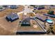 Aerial view showing a house with solar panels and a pool in a residential area at 825 Desmoines Pl, Kissimmee, FL 34759