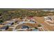 Aerial view of neighborhood with houses and lots at 825 Desmoines Pl, Kissimmee, FL 34759