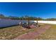 Backyard patio with seating area and fire pit at 825 Desmoines Pl, Kissimmee, FL 34759