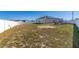 Large backyard with fenced perimeter and solar panels at 825 Desmoines Pl, Kissimmee, FL 34759