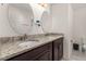 Bathroom with double vanity and granite countertop at 825 Desmoines Pl, Kissimmee, FL 34759