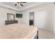 Main bedroom with king-size bed and ensuite bathroom at 825 Desmoines Pl, Kissimmee, FL 34759