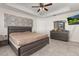 Main bedroom with king-size bed and dresser at 825 Desmoines Pl, Kissimmee, FL 34759