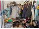 Spacious walk-in closet with ample shelving and rod at 825 Desmoines Pl, Kissimmee, FL 34759