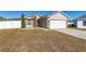 House with a red door and a white fence at 825 Desmoines Pl, Kissimmee, FL 34759