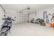 Garage with space for a scooter, bicycle and storage at 825 Desmoines Pl, Kissimmee, FL 34759