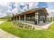 Community park pavilion with screened sides and picnic tables at 825 Desmoines Pl, Kissimmee, FL 34759