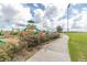 Playground next to a walking path and grassy field at 825 Desmoines Pl, Kissimmee, FL 34759