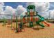Modern playground featuring a large climbing structure and slides at 825 Desmoines Pl, Kissimmee, FL 34759