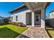 Landscaped backyard with covered patio and modern fence at 8664 Dubochet St, Orlando, FL 32827