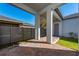 Covered patio with brick pavers and modern fence at 8664 Dubochet St, Orlando, FL 32827
