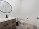 Simple bathroom with floating vanity and oval mirror at 8664 Dubochet St, Orlando, FL 32827