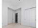 Spacious bedroom with neutral walls and carpet flooring, and double door closet at 8664 Dubochet St, Orlando, FL 32827
