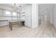 Bright dining area with built-in shelving and large island at 8664 Dubochet St, Orlando, FL 32827