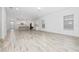 Open concept kitchen features island and stainless steel appliances at 8664 Dubochet St, Orlando, FL 32827