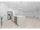 Modern kitchen with stainless steel appliances and white cabinetry at 8664 Dubochet St, Orlando, FL 32827