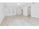 Large living room with neutral walls and wood-look tile flooring at 8664 Dubochet St, Orlando, FL 32827