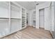 Spacious walk-in closet with ample shelving at 8664 Dubochet St, Orlando, FL 32827