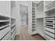Large walk-in closet with ample shelving and drawers at 8664 Dubochet St, Orlando, FL 32827