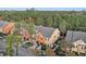 Aerial view of townhouses nestled in a wooded area at 879 Assembly Ct, Reunion, FL 34747