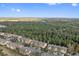 Aerial view of townhouses and surrounding landscape at 879 Assembly Ct, Reunion, FL 34747