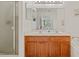 Double vanity bathroom with a large mirror and separate shower at 879 Assembly Ct, Reunion, FL 34747