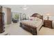 Spacious Primary bedroom with king-size bed and ensuite bathroom at 879 Assembly Ct, Reunion, FL 34747