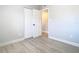 Bright bedroom with gray walls and wood-look floors, and a double door closet at 101 Gerry Dr, Altamonte Springs, FL 32714
