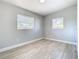 Well-lit bedroom featuring gray walls and wood-look flooring at 101 Gerry Dr, Altamonte Springs, FL 32714